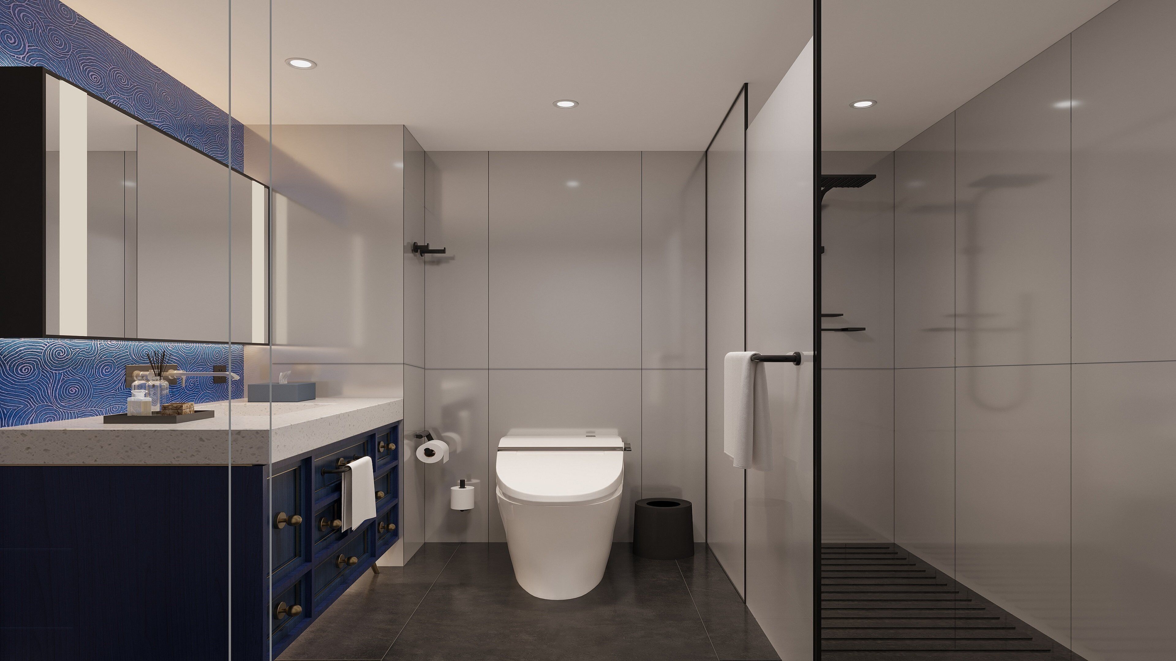 Un baño moderno con inodoro, lavabo y zona de ducha.