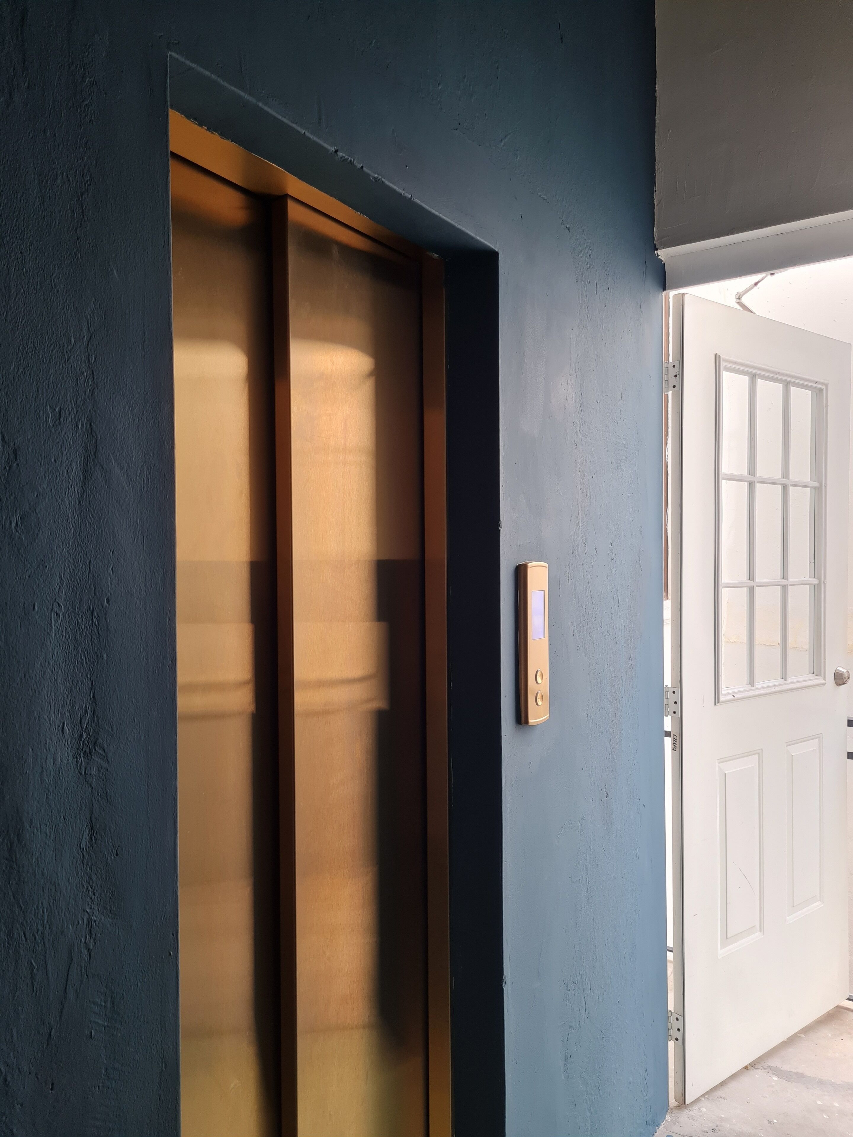 A room with a sliding door leading to a hallway.