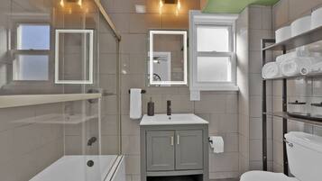 Shower, hair dryer, towels, soap