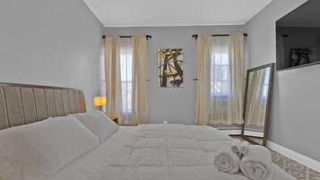 2 chambres, coffres-forts dans les chambres, fer et planche à repasser