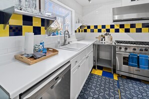 Fridge, microwave, stovetop - The Blue Moon House has 5 bedrooms, each with a private bath, plus kitchen, dining and living area. (Ashland)