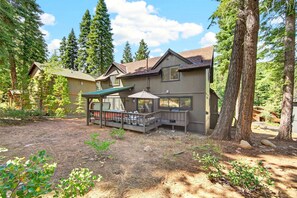 A two-story house with a deck and a covered patio area. - The Seasons Tahoe 4bdr Cabin (Tahoe Vista)