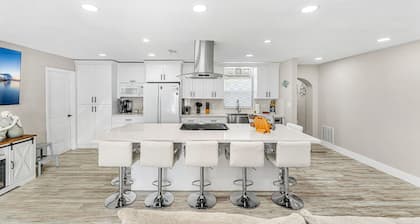 Spacious Home w/ Private BBQ Backyard Oasis, Bikes & Games – Walk to the Beach!