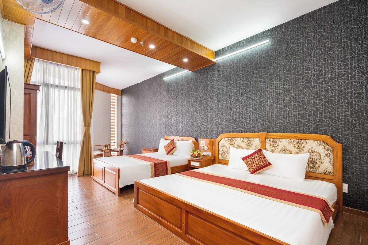 Habitación cuádruple familiar | Minibar, caja fuerte, wifi gratis y ropa de cama