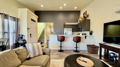 Centralia home minutes to NW Sports Hub.  Modern two bedroom - primary ensuite. Main level bedroom with full bathroom adjacent.  Full kitchen. Fully fenced backyard with covered patio.  In home laundry - full size washer/dryer. Parking - 4 cars