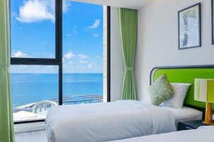 Two-Bedroom Ocean View & Fireworks Premier Suite | Egyptian cotton sheets, premium bedding, individually decorated