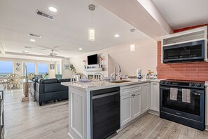 Fridge, microwave, oven, stovetop - Sprawling ocean view home with shared pool, balconies, & direct beach access (Galveston)
