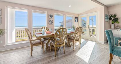 Sprawling ocean view home with shared pool, balconies, & direct beach access