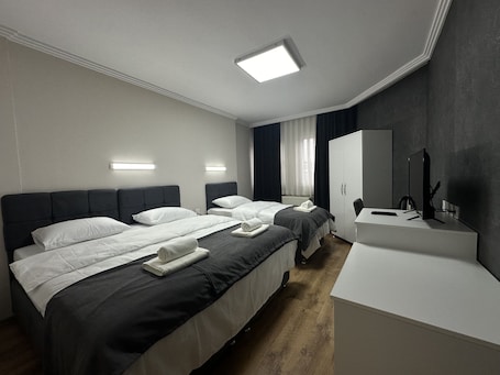 Standard Triple Room | Premium bedding, minibar, desk, laptop workspace