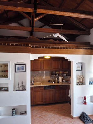 Full-sized fridge, oven, toaster, paper towels