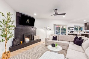 TV, fireplace, books, offices