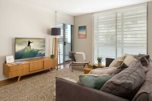 TV, offices - Ocean Breeze Retreat: Kings Coastal Apartment (Kings Beach)