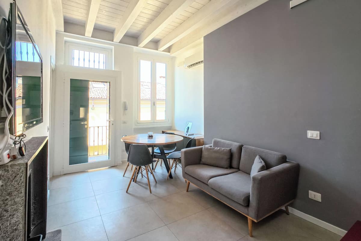 Family Duplex | Living area | 45-inch flat-screen TV with satellite channels, Netflix