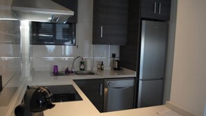 A modern kitchen with stainless steel appliances, a dishwasher, and a built-in oven. - Penthouse Oasis beach IV La zenia (La Zenia)