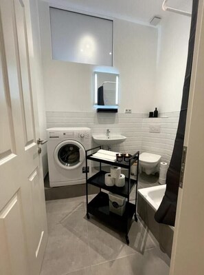 Shower, hair dryer, towels, soap