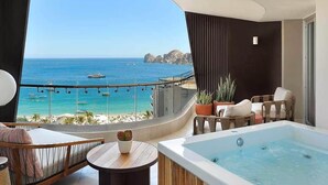 A balcony with a view of the sea, a hot tub, and seating area. - Corazón Resort&Spa: 2BR Corazon Suite w/ private hot tub, ocean view, sleeps 8 (Cabo San Lucas)