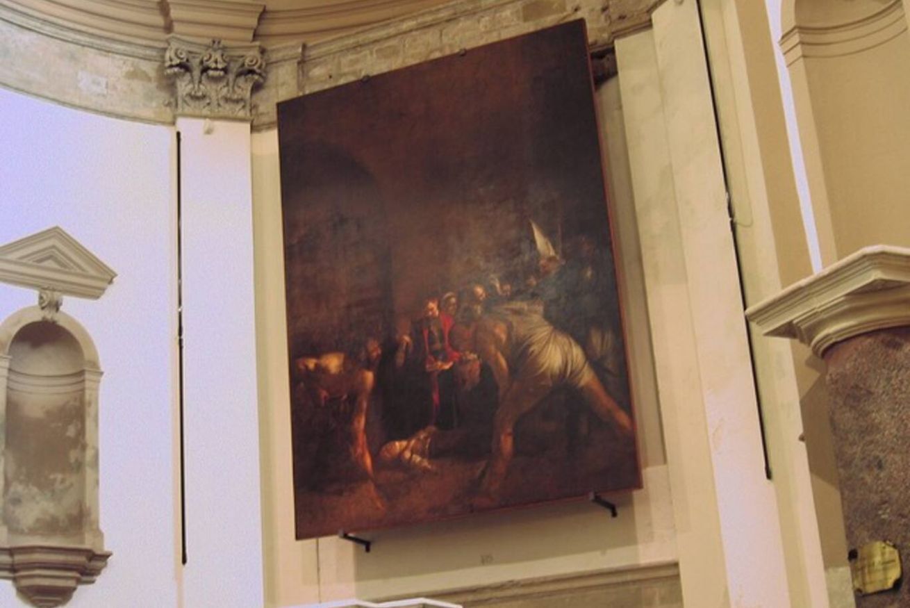 A large classical painting in a room with architectural details like columns and arches.