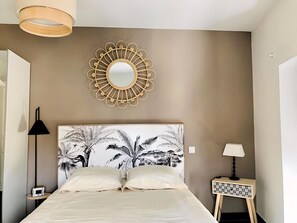 1 bedroom, desk, iron/ironing board, travel crib