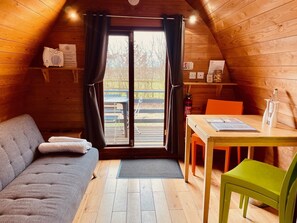 Living area - MegaPod 1 at Lee Wick Farm Glamping (Clacton on Sea)
