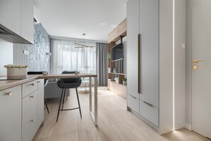 Appartamento Deluxe | 1 camera, ferro/asse da stiro, culle/letti per bambini (a pagamento)