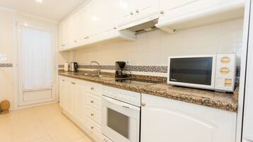 Apartment | Private kitchen | Full-size fridge, microwave, oven, toaster