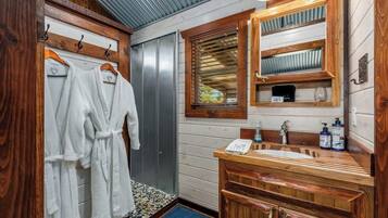 Shower, hair dryer, towels, shampoo