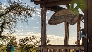 A rustic wooden structure with a sign that reads 'STINGSTAR.'