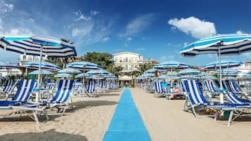 Private beach, white sand, sun-loungers, beach umbrellas