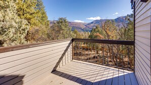 A wooden deck with a railing, overlooking a mountainous landscape with trees and a clear sky. - Near Trails! Sun-drenched Durango Escape w/ View (Durango)