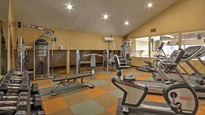 A gym with various exercise equipment including treadmills, weight machines, and free weights. - Cozy Brian Head Condo: Walk to Navajo Express Lift (Brian Head)