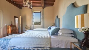 A bedroom with a large bed, a dresser, a chair, and a view of the outdoors. - Casa Lionardo, Vinci, Florence and Chianti (Vinci)