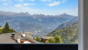 A mountain landscape with a village in the valley.