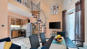 A modern apartment with a kitchen, dining area, and a living room. - Modern apartment Oleandra, 5 only 250 meters from the sea (Baska)