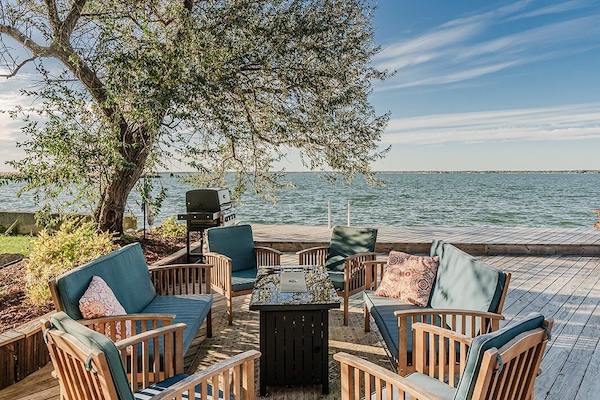 Plenty of outdoor seating options and a gas grill on the deck