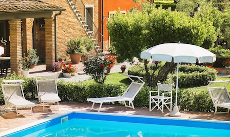 Seasonal outdoor pool, pool umbrellas, pool loungers