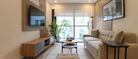 Apartment, 2 Bedrooms (204) | Living area | 40-inch Smart TV with cable channels