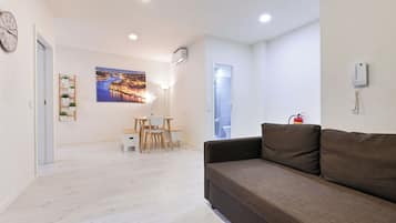 Superior Apartment, 2 Bedrooms | Living area | 43-inch flat-screen TV with digital channels