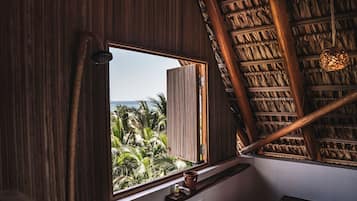 Habitación Elite | Baño | Regadera, toallas, jabón, shampoo