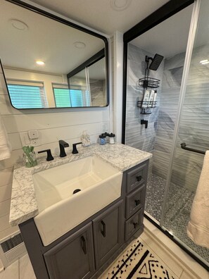Shower, hair dryer, towels, soap