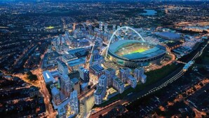 An aerial view of a city with a large stadium surrounded by high-rise buildings and roads. - Home Sweet Home: Whole Apartment 15mins to Central

 (Wembley)