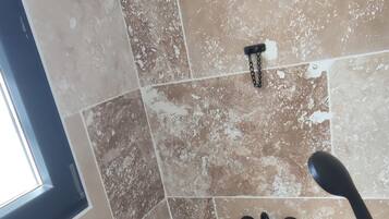 Shower, hair dryer, towels, toilet paper