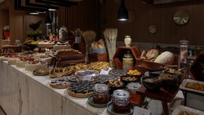 A buffet with various food items and condiments. - Radisson Hotel & Residence Riyadh Olaya (Riyadh)