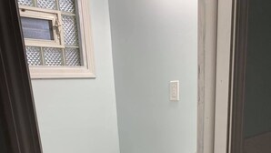 A small bathroom with a toilet, a sink, and a cabinet. - The Palms Motel (Geneva)