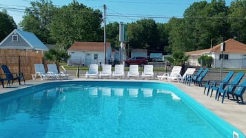 Seasonal outdoor pool, pool loungers