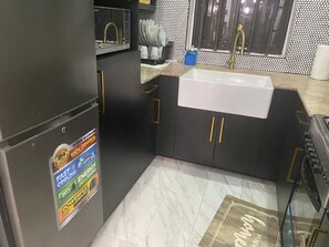 Fridge, microwave, oven, stovetop - HOUSE OF ISAAC: Modern Luxury Home
Sleeps: 06 -
 Bedrooms: 03 -
 Bathrooms: 03 (Lomé)