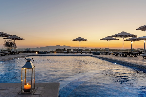 Seasonal outdoor pool, open 9:00 AM to 6:30 PM, pool umbrellas