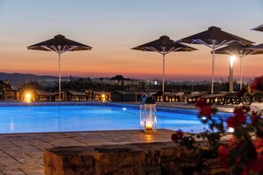 Seasonal outdoor pool, open 9:00 AM to 6:30 PM, pool umbrellas