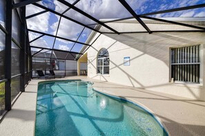 An indoor swimming pool with a glass ceiling, a poolside seating area, and a sign indicating pool rules. - 630 - Great 3 Bed 2 bBath Villa With Private South Facing Pool (Davenport)