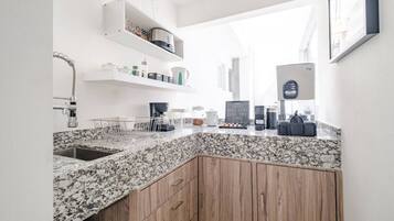 Microwave, coffee/tea maker, toaster, cookware/dishes/utensils