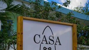 A sign with the text "CASA NANIKI" and a logo, framed by a wooden border. - Surfer Villa +Pool in Rincon’s Heart walk to Beach (Rincon)